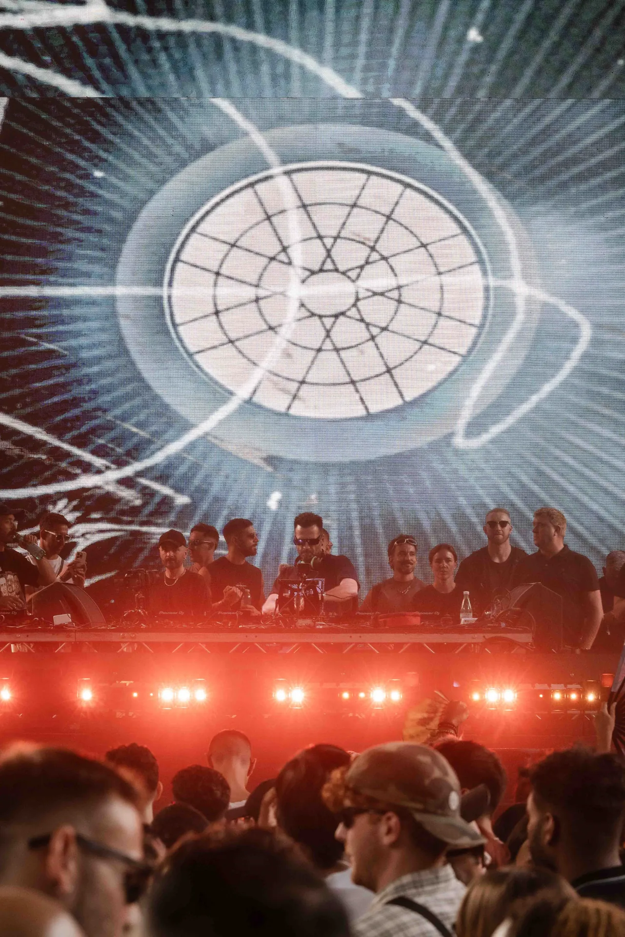 Musicians playing live at a concert, engaging with the audience and delivering an electrifying performance.